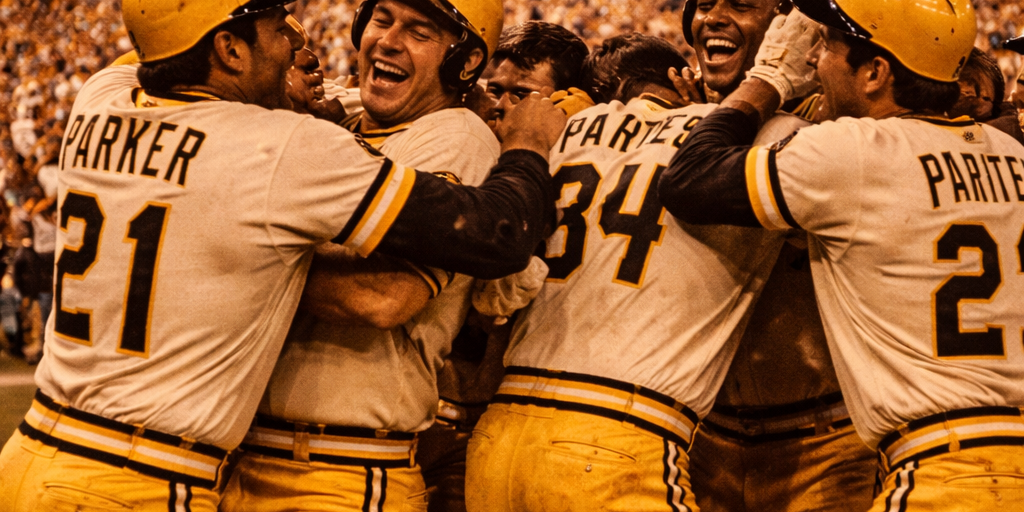 Pittsburgh Pirates players celebrate on the field in their classic gold and black uniforms after winning the 1979 World Series, capturing the joy of the We Are Family championship season.