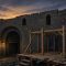 Illustration of the stone yard wall of a Gilded Age jail with a wooden scaffold being built at dusk